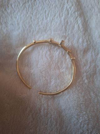 Pulsera ajustable caña clavo dorada acero