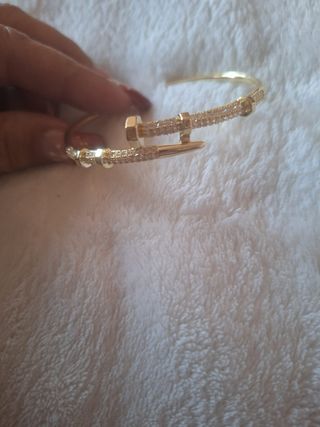 Pulsera ajustable caña clavo dorada acero