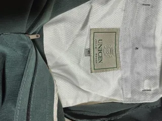 Traje de chaqueta verde oscuro