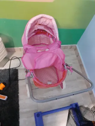 Carrito de muñecas rosa con unicornio