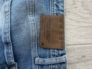Jeans uomo strappati blu taglia 46