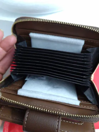 Billetera Carolina Herrera CH monograma