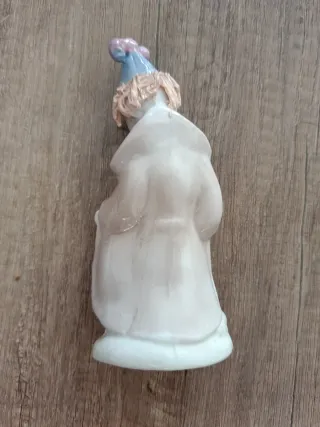 Figura de porcelana payaso con perros