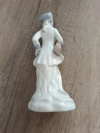 Figura de porcelana músico