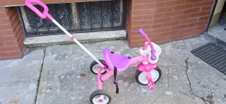 Triciclo rosa in alluminio.