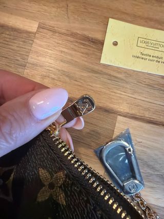 Portamonete con ciondolo Louis Vuitton Marrone