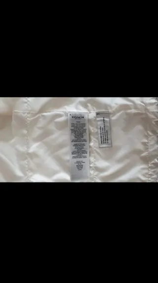 Parka larga Coach beige con capucha