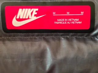 Chaqueta Nike de Plumas gris