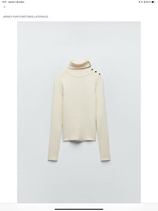 Jersey punto cuello alto botones laterales