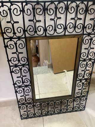 Espejo de forja con marco dorado
