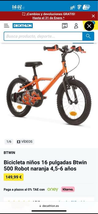 Bicicleta infantil naranja niño con ruedines