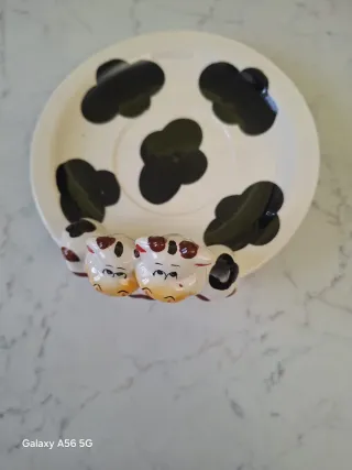 Tazza e piattino in porcellana a tema mucca