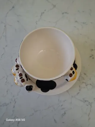 Tazza e piattino in porcellana a tema mucca