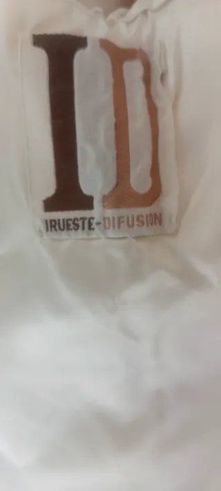 Abrigo pura lana rizado blanco beis