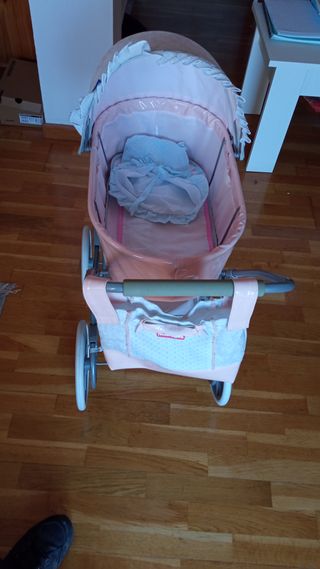 Carrito de bebé de juguete rosa