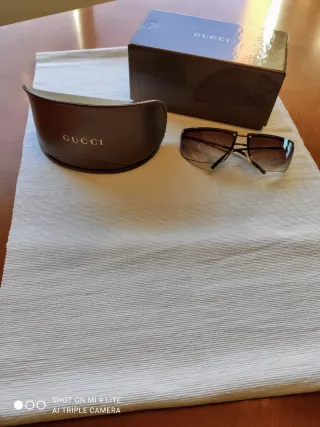 Gafas de sol Gucci marrones y doradas