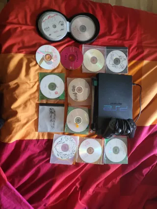 Playstation 2 Negra + 12 DVDs y mas