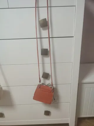 Bolso naranja niña cadena