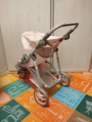 Carro de muñecas rosa con estrellas