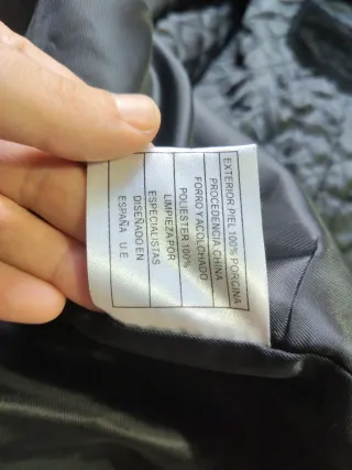 Chaqueta larga negra con pelo de piel natural