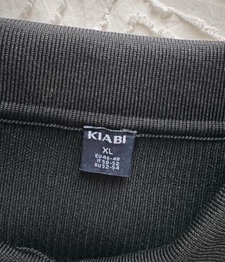 Jersey polo canalé negro mujer