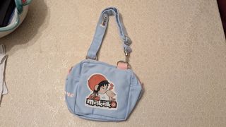 Borsetta azzurra per bambini con dettagli rosa