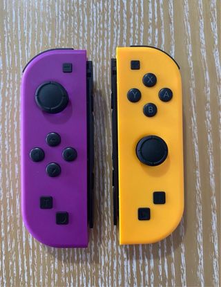 Joycons morado y naranja nintendo switch