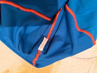 Maillot Zoot azul con cremallera naranja