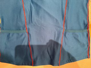 Maillot Zoot azul con cremallera naranja