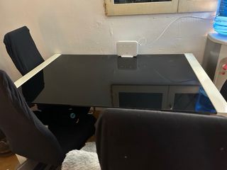 Mesa de comedor extensible de hierro y cristal