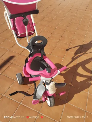 Triciclo infantil rosa y gris