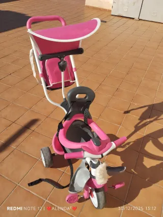 Triciclo infantil rosa y gris
