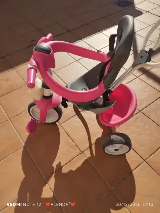 Triciclo infantil rosa y gris