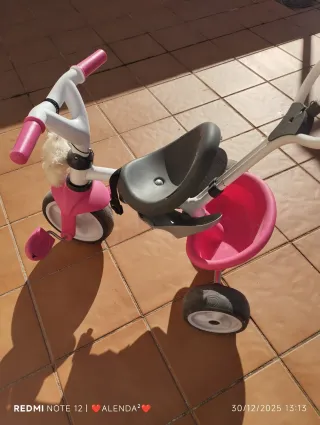 Triciclo infantil rosa y gris