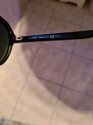 Occhiali da sole Gucci neri e oro
