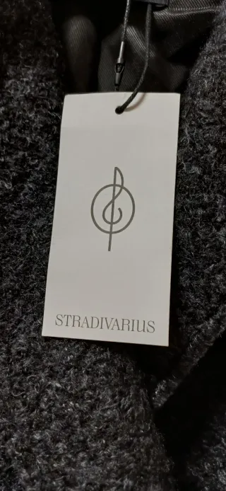 Abrigo jaspeado nuevo  Conserva etiqueta.  A estre