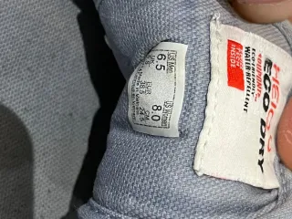 Zapatillas Vans grises y blancas