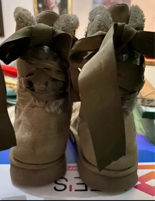 Stivali con fiocco e pelliccia