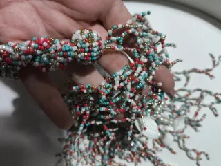 Collana Camomilla corallo e conchiglie