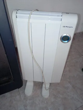 Estufa de gas y radiador eléctrico