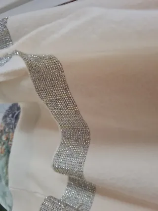 Jersey cuello alto beige talla L con detalles