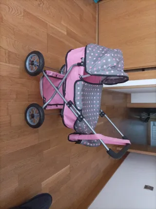 Silla de paseo para muñecas rosa