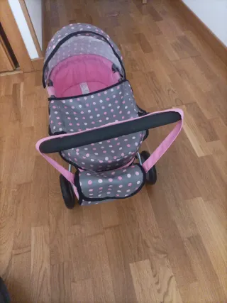 Silla de paseo para muñecas rosa
