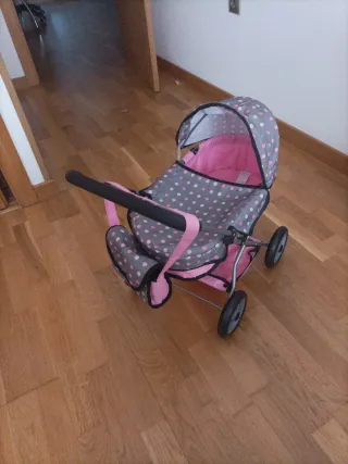 Silla de paseo para muñecas rosa