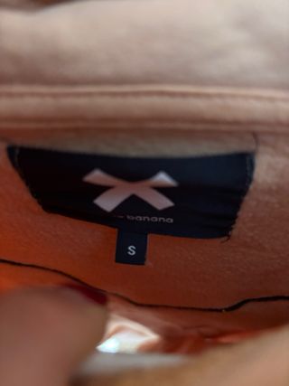 Sudadera rosa con parche X
