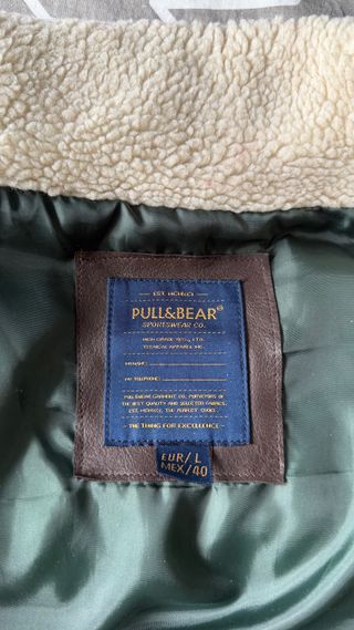 Chaleco acolchado verde con detalles