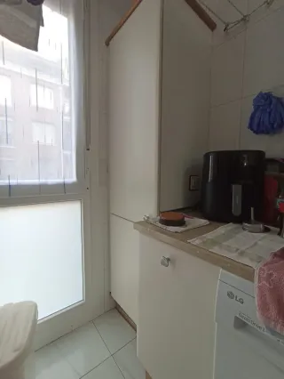 Muebles de cocina beige y marrón