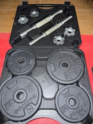Banco de pesas con barra y discos