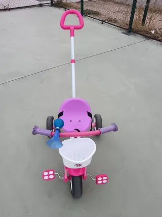 Triciclo infantil rosa con bocina