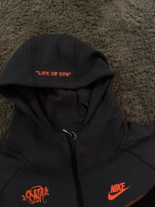 Conjunto Nike Tech Fleece Syna World